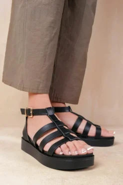 Sandals*Where's That From Dubai' Extra Wide Fit Mid Platform Gladiator Strap Black
